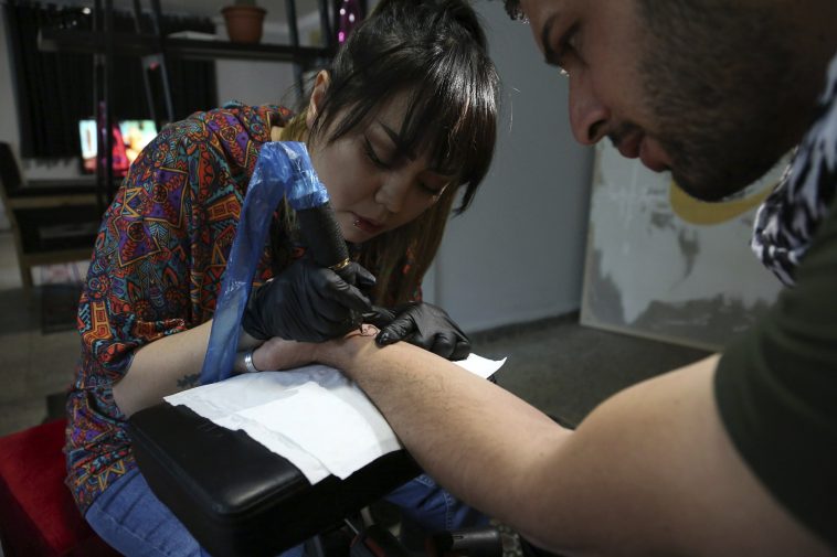 A tattoo at a time, Afghan woman takes on society’s taboos